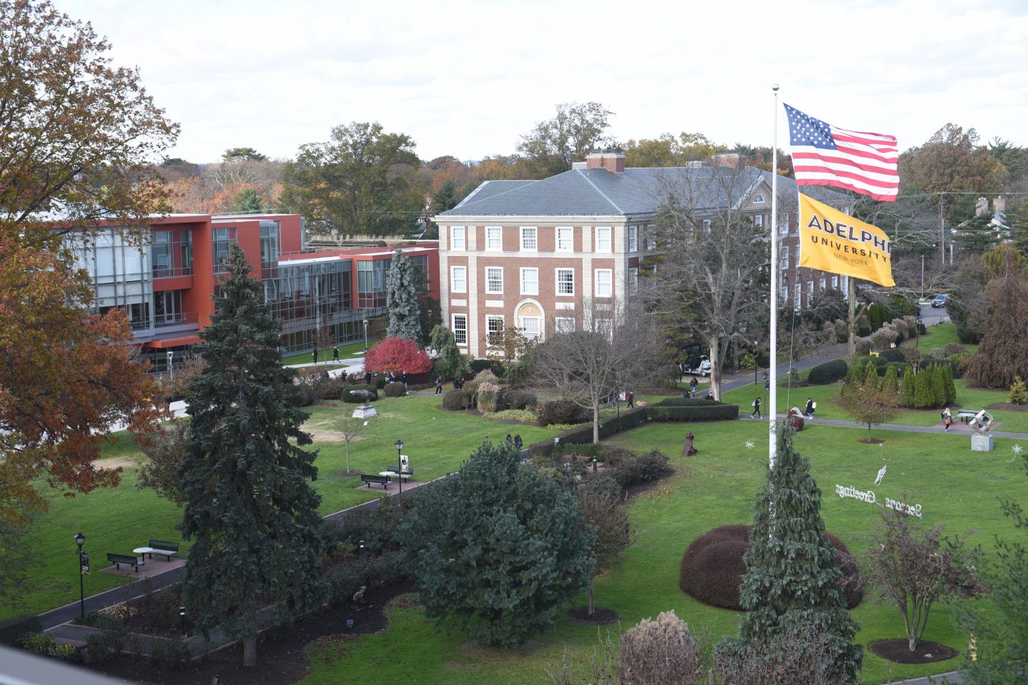 Aerial view of Ҵý, Garden City campus - Showing Nexus Building, Levermore Hall and the Flagpole lawn with both American and Adelphi flags waving.
